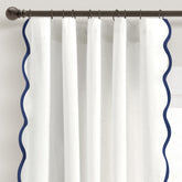 Lush Decor front view of navy and white scalloped curtains showing light-filtering benefit