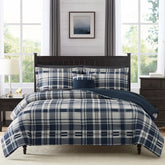 MaiRêve comforter front view showing navy plaid and polished bedroom look