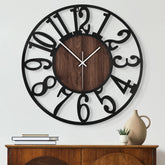 Maxstar front view showing black metal rim and walnut wood face, stylish focal point
