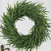 MDSTBN 26-inch front view showing full green pine wreath and curb appeal