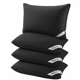 Melising front view of four black pillows showing coordinated hotel look and instant bedroom upgrade