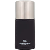 Microplane spice mill front view showing sleek stainless design and easy grip benefit