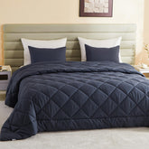 MIOTO comforter front view showing oversized coverage and elegant finish