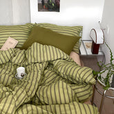 mixinni front view duvet cover showing olive and taupe stripes and elegant look