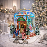Moments in Time front view showing lit tree shop and festive exterior