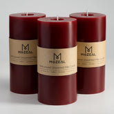 MOZEAL front view of three dark red pillar candles showing rustic finish and shape benefit ambiance