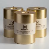 MOZEAL front view of three gold pillar candles showing rustic finish and packaging, adds warm decor