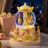 Mr.Winder front view of yellow carousel snow globe showing charm and elegance