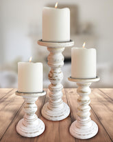 My Fancy Farmhouse front view of three-piece antique white candlestick set adding rustic charm