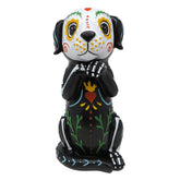 Needzo front view of dog figurine showing sugar skull patterns and festive charm