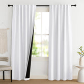 NICETOWN front view of pure white blackout curtain pair showing clean look and coverage