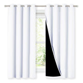 NICETOWN front view of white blackout curtains shows full coverage and elegant drape