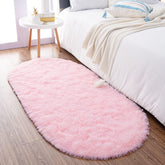 Noahas front view of pink oval rug showing shape and color for soft decor