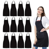 NOBONDO front view of twelve black bib aprons showing neat stack and uniform look