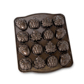 Nordic Ware front view of bronze cakelet pan showing sixteen cavities and textured finish for even baking