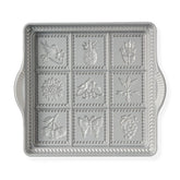 Nordic Ware front view of shortbread pan showing molded shapes and rope border for attractive cookies
