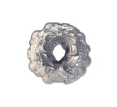 Nordic Ware front view of wreath pan shows shape and festive details for easy centerpiece baking