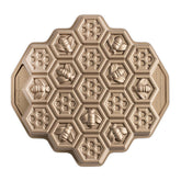 Nordic Ware pan front view showing honeycomb shape and crisp detail benefits even browning