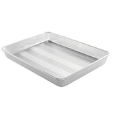 Nordic Ware front view of high-sided sheet pan showing size and sturdy rims for reliable baking