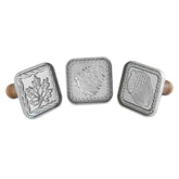 Nordic Ware front view of three cast aluminum cookie stamps showing designs and handles, durable embossing