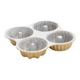 Nordic Ware front view of quartet pans showing gold finish and shapes, showcasing versatility