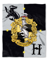 Northwest Hufflepuff throw front showing full-color crest and clear emblem
