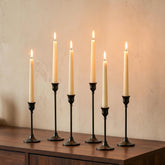 NUPTIO front view of six black candlestick holders showing elegant set benefits