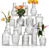 ODBCYWM front view of assorted clear bud vases showing vintage shapes for elegant tables