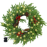 Ogrmar wreath on front door showing lit decorations and welcoming curb appeal