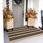 OJIA front view of black and tan outdoor rug showing clean entry styling benefit