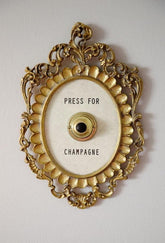 Okuorze front plaque showing press for champagne and festive appeal