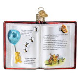 Old World Christmas Winnie the Pooh book ornament front view showing storybook design and sparkle