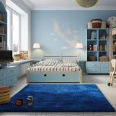 Ophanie blue rug front view showing plush royal dark blue pile and neat edges for elegant decor