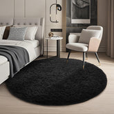 Ophanie round rug front view showing plush black surface and neat edges for cozy decor
