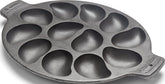 Outset cast iron oyster grill pan front view showing twelve wells and sturdy rim for serving