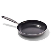 OXO 10-inch pan front view showing sleek black finish and reliable cooking surface benefit