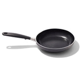 OXO 8-inch frying pan front view showing black ceramic finish and handle, easy cooking