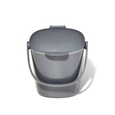 OXO Good Grips front view showing compact countertop compost caddy and charcoal finish
