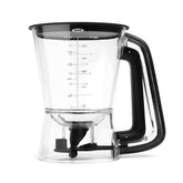 OXO dispenser front view showing clear body and ergonomic handle for neat pouring
