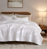 palassio front view of striped white quilt showing full coverage and clean styling