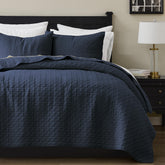 palassio navy quilt front view showing full queen cover and neat drape for visual appeal