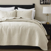 palassio front view of king quilt on bed showing neutral styling and cozy look