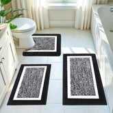 Pauwer front view of black 3-piece rug set showing plush mats and coordinated look