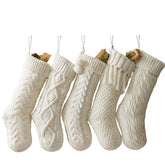 Pawliss five-pack front view showing cream cable-knit stockings and tidy patterns for cohesive mantle décor