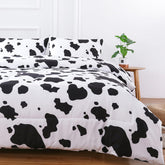 PERFEMET front view of queen comforter showing modern cow print and bold contrast
