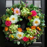 Pinkpuii front view wreath creating a welcoming porch focal point