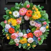 Pinkpuii front view wreath on door showing welcoming curb appeal