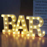 Pooqla BAR front view showing warm white LED letters and bold marquee look