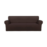 PureFit front view on sofa showing full chocolate coverage and tidy appearance