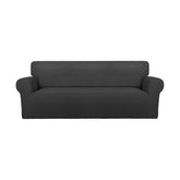 PureFit front view on oversized sofa showing full coverage and refreshed look